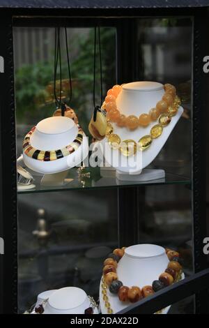 Shop window display of traditional Baltic coast amber jewellery on sale in the Old Town. Stock Photo