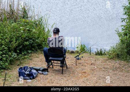 Man fishing on a lake Stock Photo
