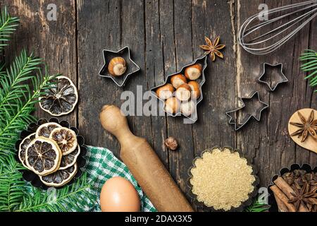 Christmas baking background. Ingredients for Christmas cooking or baking on rustic wooden table. Top view with copy space. Stock Photo