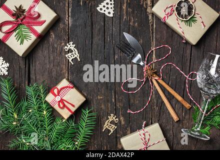 Christmas table place setting with christmas decorations and gifts, top view with copy space. Winter Holidays background. Stock Photo