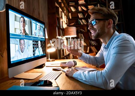 Businessman having virtual team meeting on video conference call using computer. Stock Photo