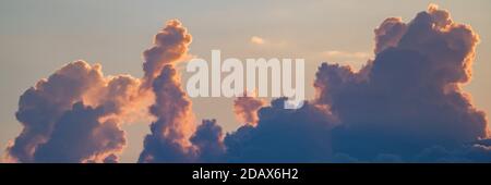 Dramatic sunset and sunrise sky with pink clouds Stock Photo