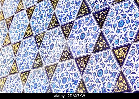 Islamic pattern on the wall of a Muslim mosque. Islamic ceramics and patterned tiles Stock Photo