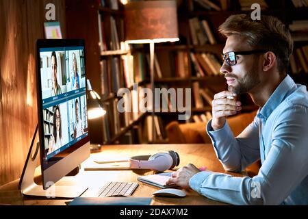 Businessman having virtual team meeting on video conference call using computer. Stock Photo