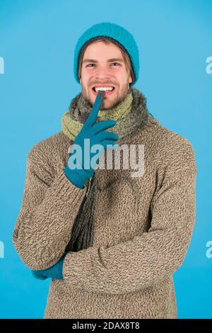 guy feel warm and comfortable. male knitwear fashion. men knitted cloth and accessory. male blue background. poor homeless man. funny man feeling cold in winter. no flu. winter weather forecast. Stock Photo