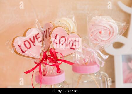 Sweets on a stick in a transparent glass jar valentine's day decoration Stock Photo