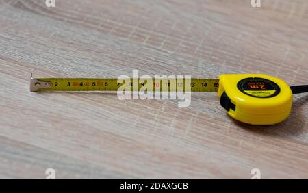 Tape measure on the table. Stock Photo