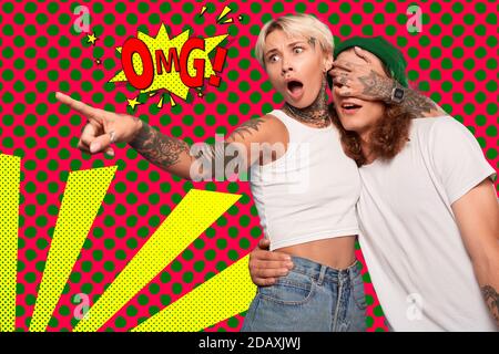 Young adult hipster couple making shocked faces Stock Photo