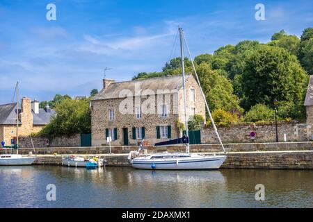 Dinan, France - August 26, 2019: Sailboats moored in Port of Dinan on the Rance River in French Brittany Stock Photo