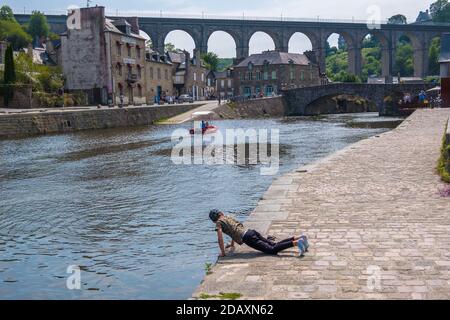 Dinan, France - August 26, 2019: Port of Dinan and Viaduct of Lanvallay over the Rance river in French Brittany Stock Photo