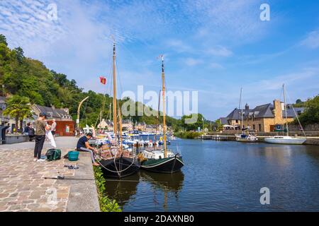 Dinan, France - August 26, 2019: Sailboats moored in Port of Dinan on the Rance River in French Brittany Stock Photo