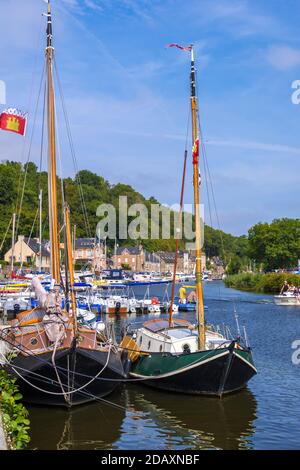 Dinan, France - August 26, 2019: Sailboats moored in Port of Dinan on the Rance River in French Brittany Stock Photo