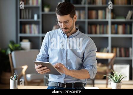 Business man working in office using tablet modern device Stock Photo
