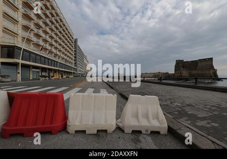 Naples, Italy. 15th Nov, 2020. View of Ovo Castle on the empty Caracciolo street on seafront. From 15 November Campania region is in the red zone with the highest level of restrictions. Credit: Independent Photo Agency/Alamy Live News Stock Photo