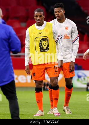 AMSTERDAM, NETHERLANDS - NOVEMBER 15: Georginio Wijnaldum of the Netherlands, Denzel Dumfries of the Netherlands during the UEFA Nations League match between Netherlands and Bosnia and Herzegovina at Johan Cruijff Arena on november 15, 2020 in Amsterdam, Netherlands (Photo by Marcel ter Bals/Orange Pictures) Stock Photo