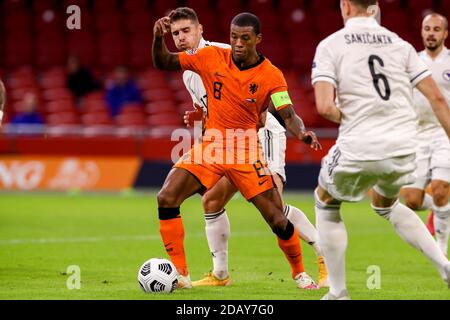 AMSTERDAM, NETHERLANDS - NOVEMBER 15: Amar Rahmanovic of Bosnia and Herzegovina, Georginio Wijnaldum of the Netherlands during the UEFA Nations League match between Netherlands and Bosnia and Herzegovina at Johan Cruijff Arena on november 15, 2020 in Amsterdam, Netherlands (Photo by Marcel ter Bals/Orange Pictures) Stock Photo