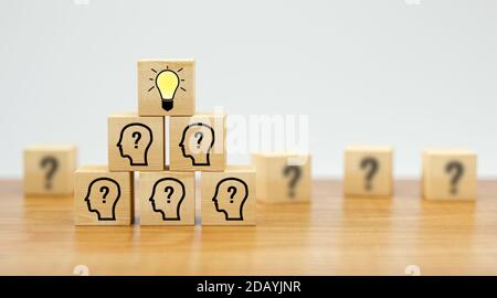 cubes showing a brainstorming session on wooden surface and white background - 3d illustration Stock Photo