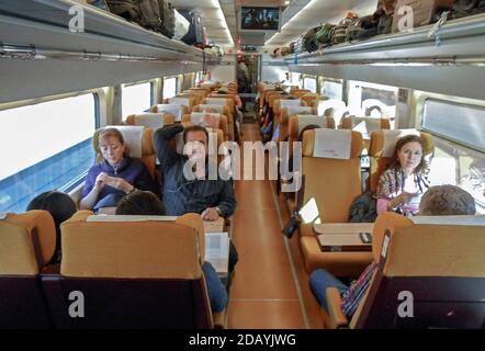 Passengers on AVE high-speed bullet train in Spain Stock Photo