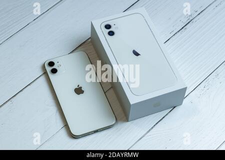 iphone-11-in-white-next-to-its