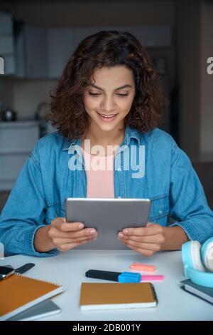 Young woman using computer tablet and working and studying online. Stock Photo