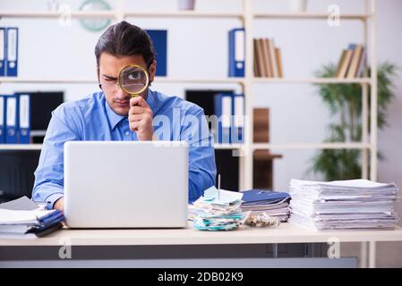 Young bookkeper in budget planning concept Stock Photo