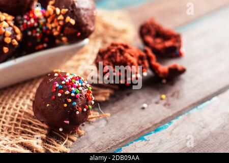 Chocolate balls on a wooden table. Stock Photo