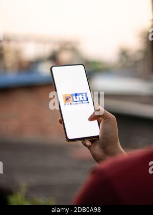 Assam, india - November 15, 2020 : UTI logo on phone screen stock image. Stock Photo