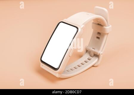 Mockup image Fitness watch on pastel background. Close-up. Front view of pink smartwatch with blank white touch screen display. fitness watch concept. Stock Photo
