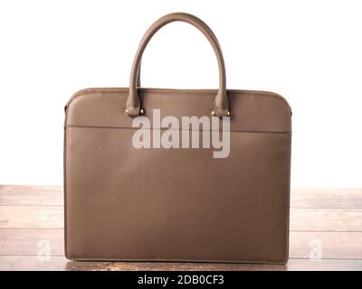 Brown color briefcase isolated on white with shadow. Brown business leather bag, Leather women casual or business briefcase on white background Stock Photo