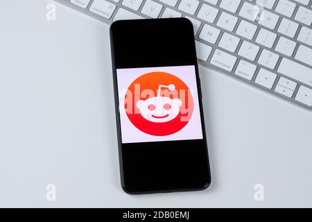 Reddit app logo on a smartphone screen. Stock Photo