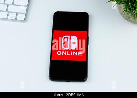 Nintendo Switch Online app logo on a smartphone screen. Stock Photo