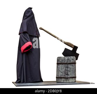 Medieval public executioner at place of separation of the head from the body beheading with an axe on a stump isolated on white Stock Photo