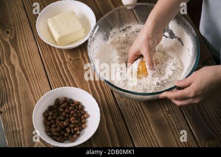 The cook mixes ingredients for apple pie. Ingredients for baking fresh pie. Top view. Toned photo Stock Photo