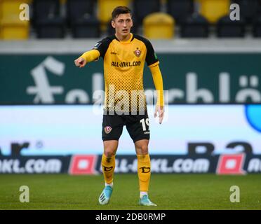 Dresden, Germany. 15th Nov, 2020. Football: 3rd division, SG Dynamo Dresden  - TSV 1860 Munich, 10th matchday, at the Rudolf-Harbig-Stadium Dynamos  Sebastian Mai (l) gesturing next to Yannick Stark. Credit: Robert  Michael/dpa-Zentralbild/dpa/Alamy