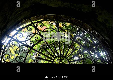 Iron cast grid over the entrance door Stock Photo