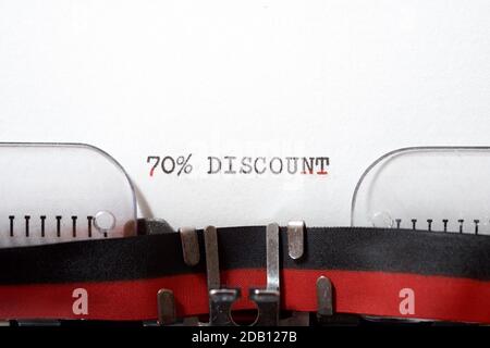 70 % discount text written on a paper. Stock Photo