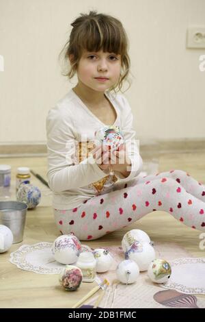 Little girl painting christmas ball Stock Photo