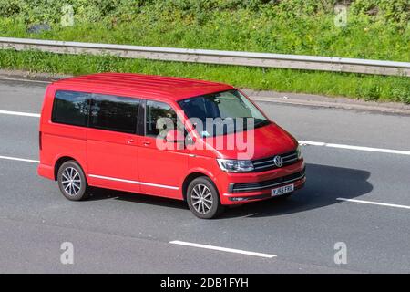 2016 red VW Volkswagen Caravelle Executive TDI B window van at the festival of Transport held the in the seaside town of Fleetwood, Lancashire, UK Stock Photo
