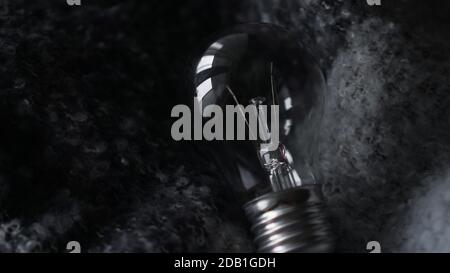 Light Bulb On a dark gray knitted background Stock Photo