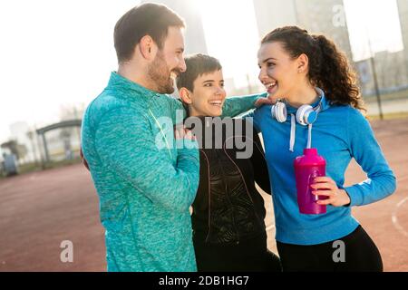Happy people enjoying friend time at jogging outdoor. Sport people healthy lifesytle concept Stock Photo