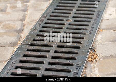 storm drainage system on the the pedestrian road is paved with bricks Stock Photo