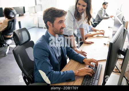 Creative people working in office on computer Stock Photo
