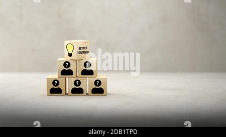 cubes showing message IDEA? and a brainstorming session on concrete ...