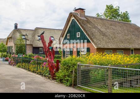 GIETHOORN, NETHERLANDS -typical dutch county side of houses and gardens Stock Photo