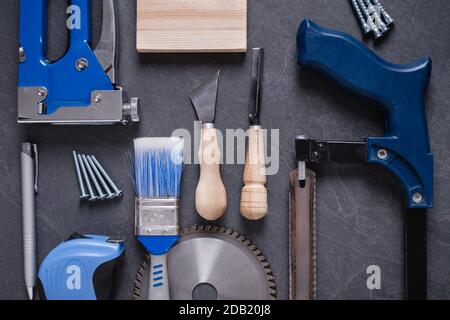 Different work construction tools for home renovation on table. Maintenance and reparing concept. Stock Photo