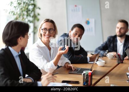 Diverse Business People Having Corporate Meeting In Modern Office Stock Photo