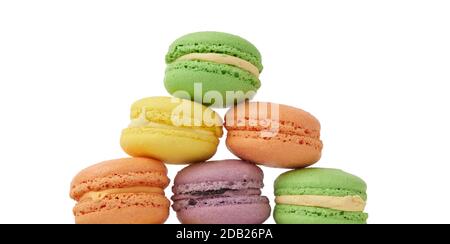 round baked multi-colored almond flour cakes macarons, dessert isolated on a white background Stock Photo