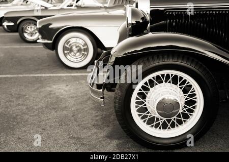 Classic cars parked in a row on the street Stock Photo
