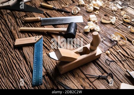 Various Carpenter Tools From Toolkit Laying On Desk Stock Photo