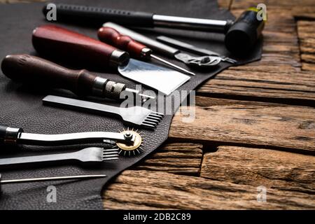 Leather Craft Tools On Desk In Tailoring Workshop Stock Photo